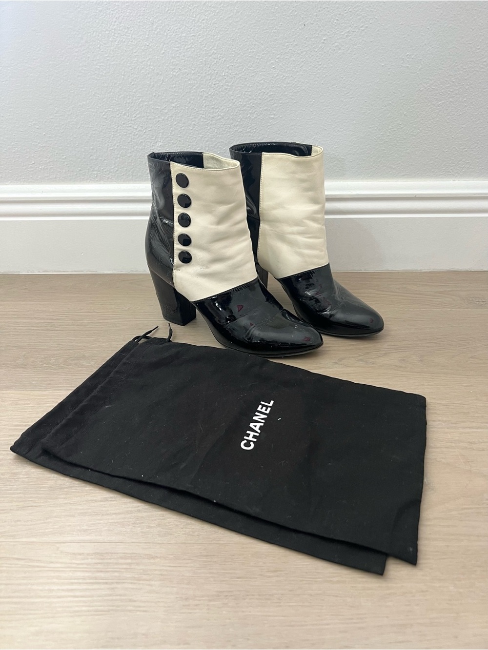 CHANEL Black & Cream Patent Leather Button-Trim Ankle Boots